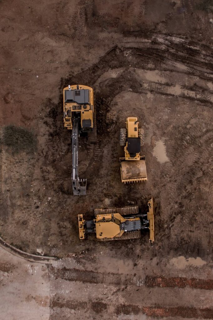 pexels-photo-1579356-1579356 Aerial Photo Of Excavator, Road Roller, And Bulldozer